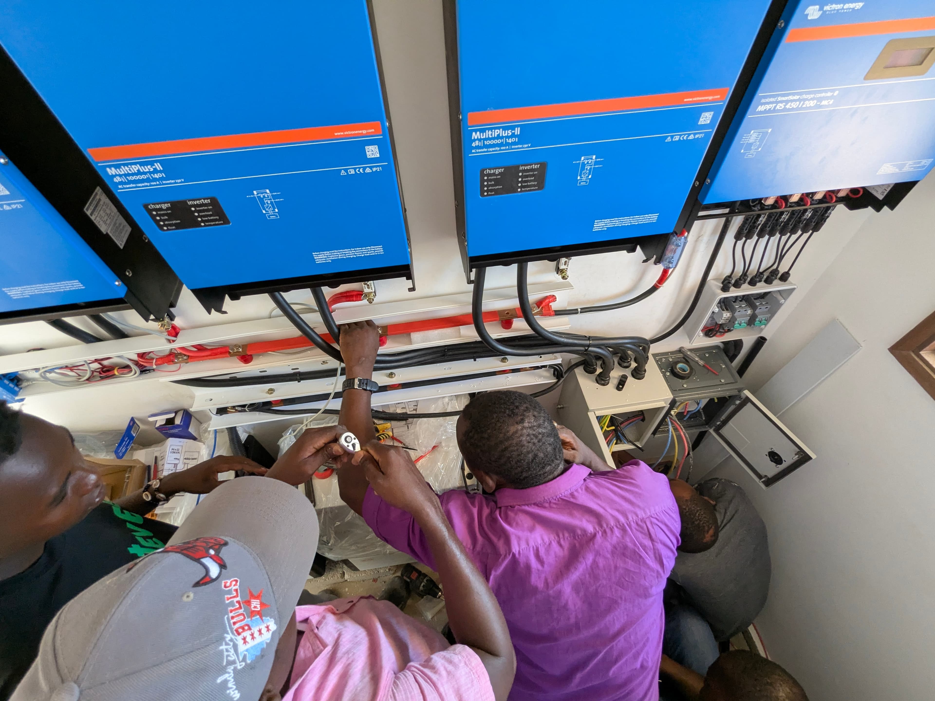 Switched On team installing an off-grid Victron system